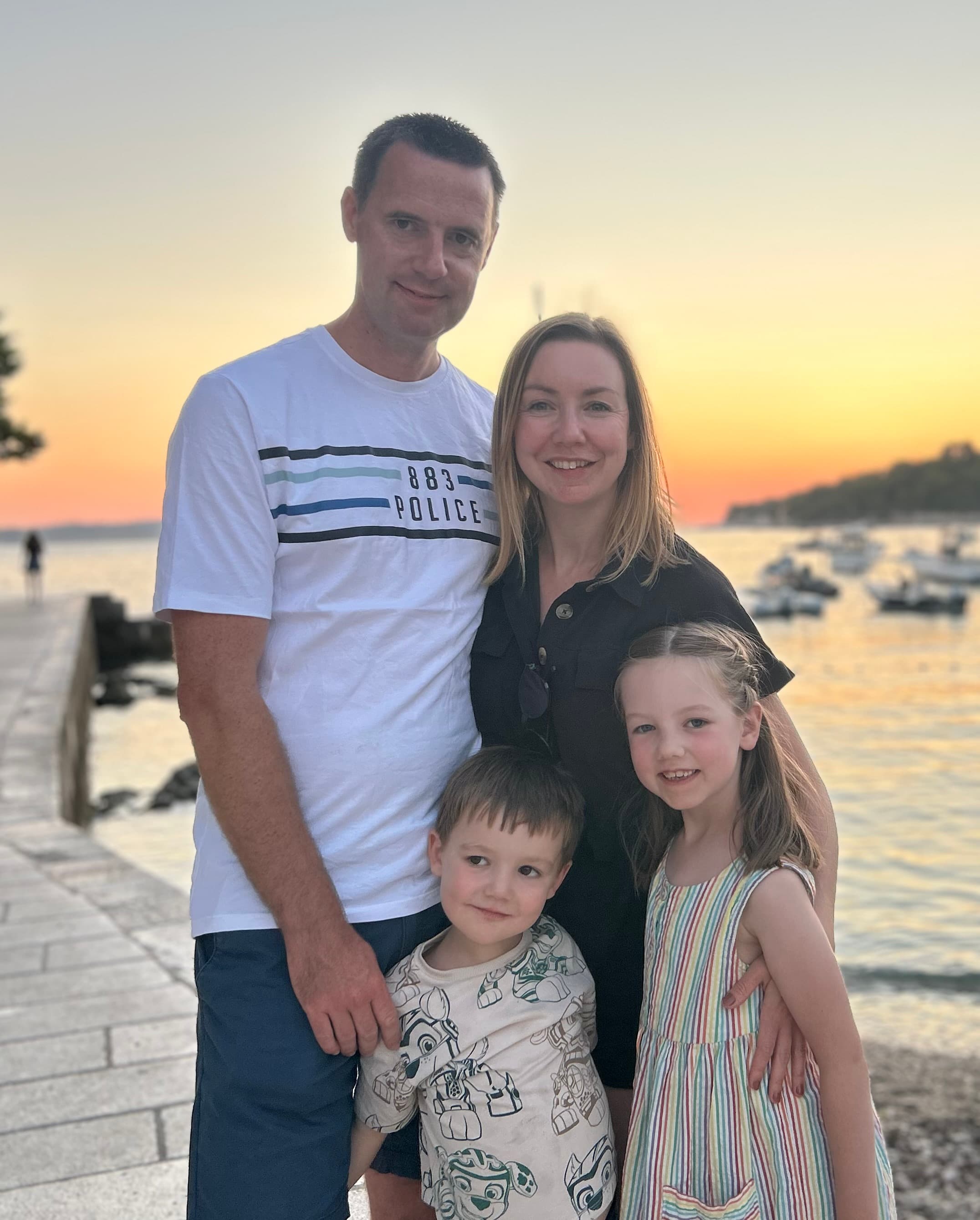 The team — parents and children together at sunset