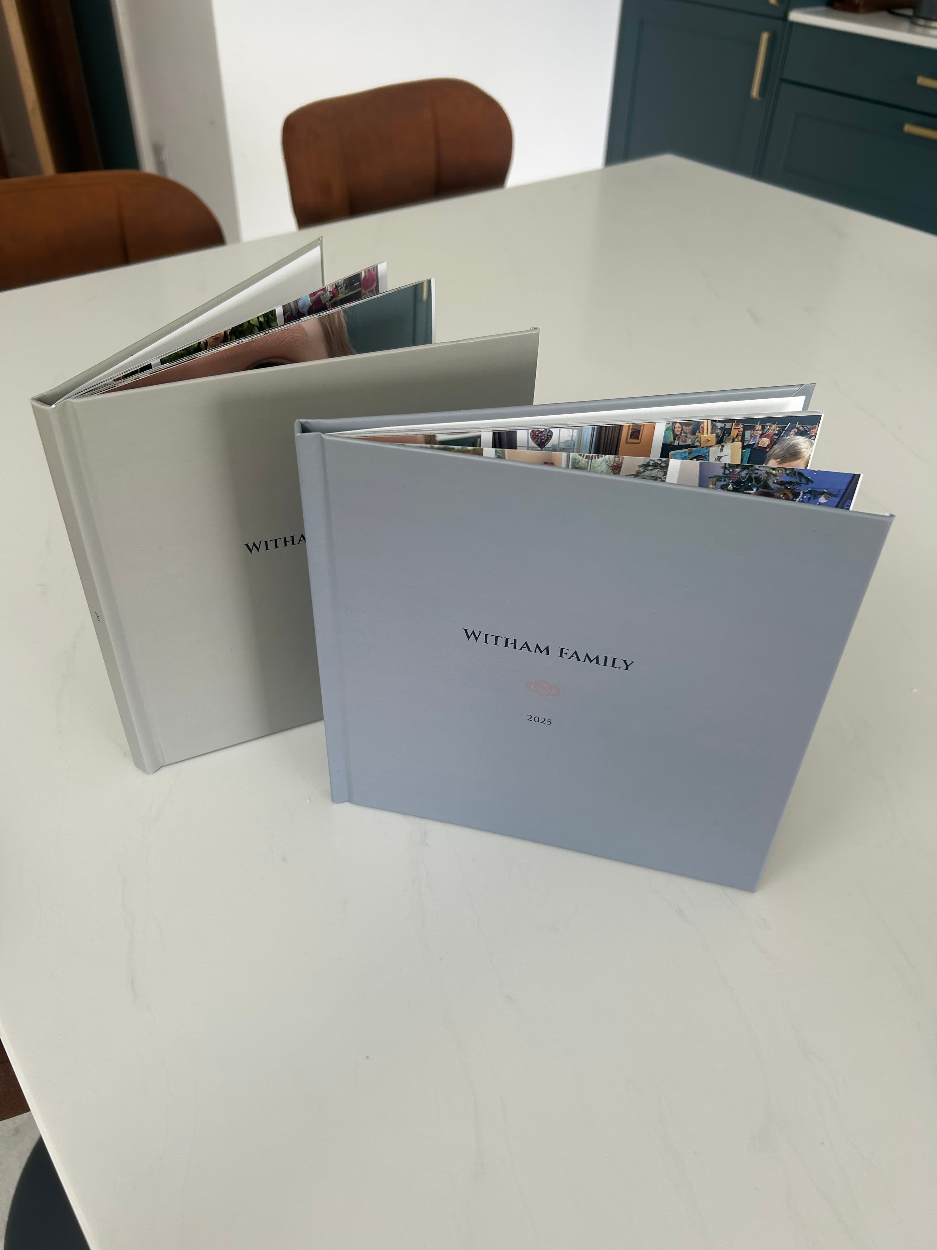 The hardcover photobook shown in its range of cover colours